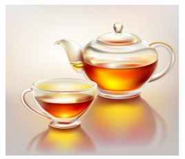 Glass teapot and cup with tea