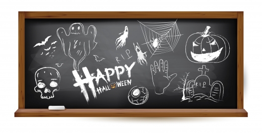 halloween hand drawing doodles on black chalkboard