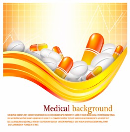 Pills and tablets on orange background